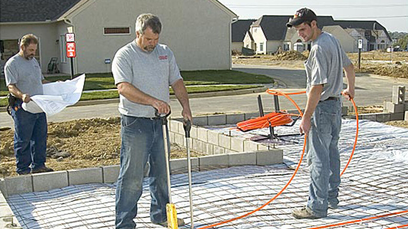 3 men installing radiant heat