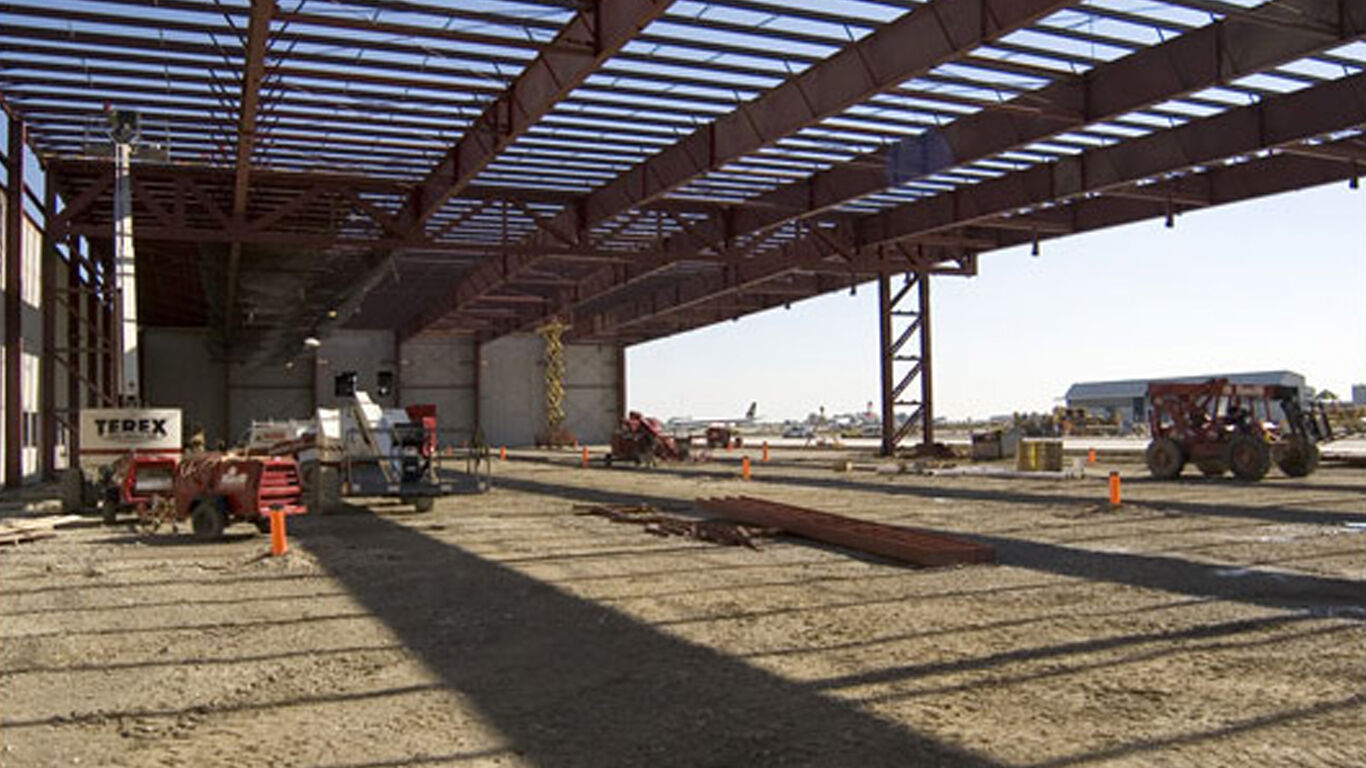 The inside of a warehouse that in being built